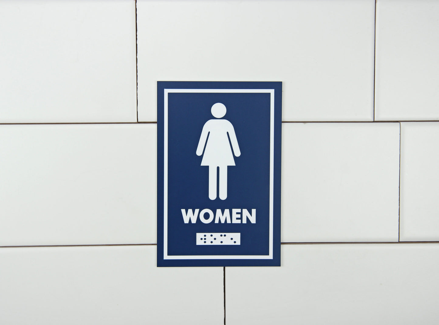 Frost Female Washroom Sign in use